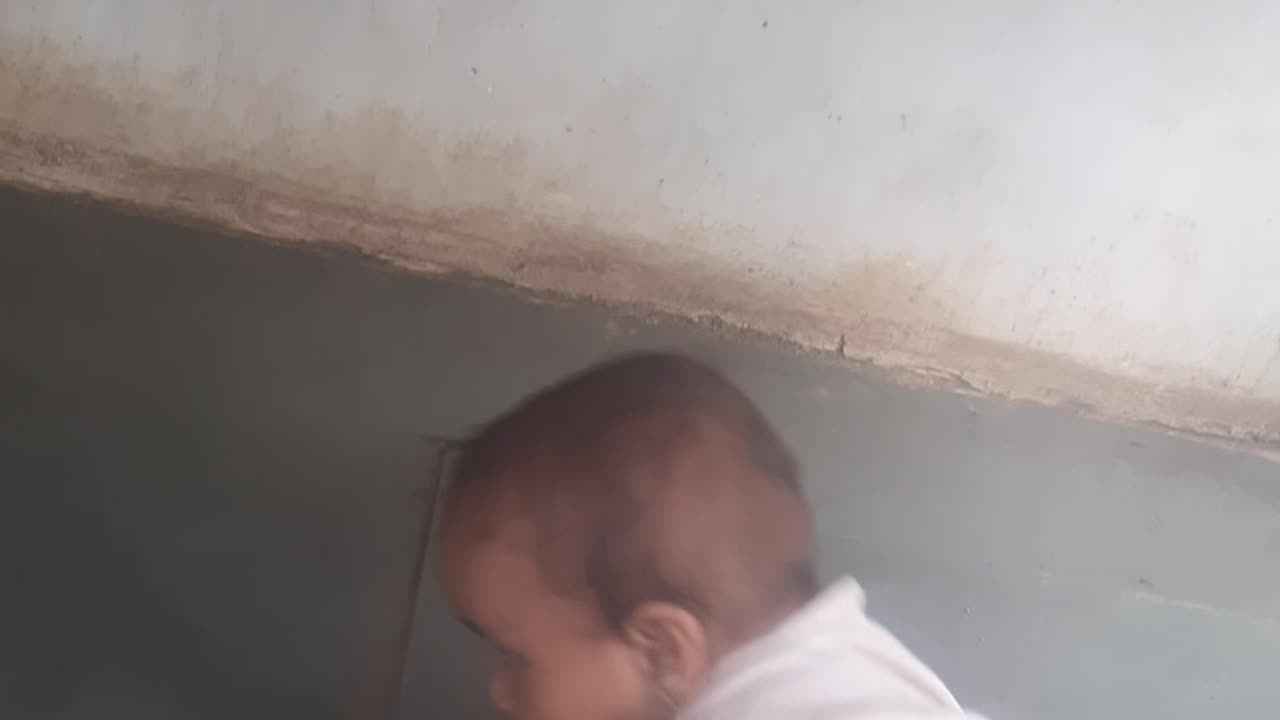 Cute Indian baby boy playing game