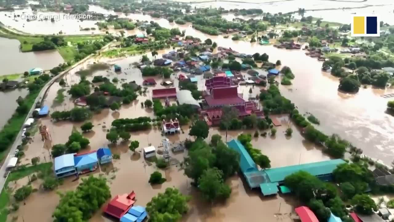 Diners in Thailand enjoy meal in flooded restaurant amid heavy rain season