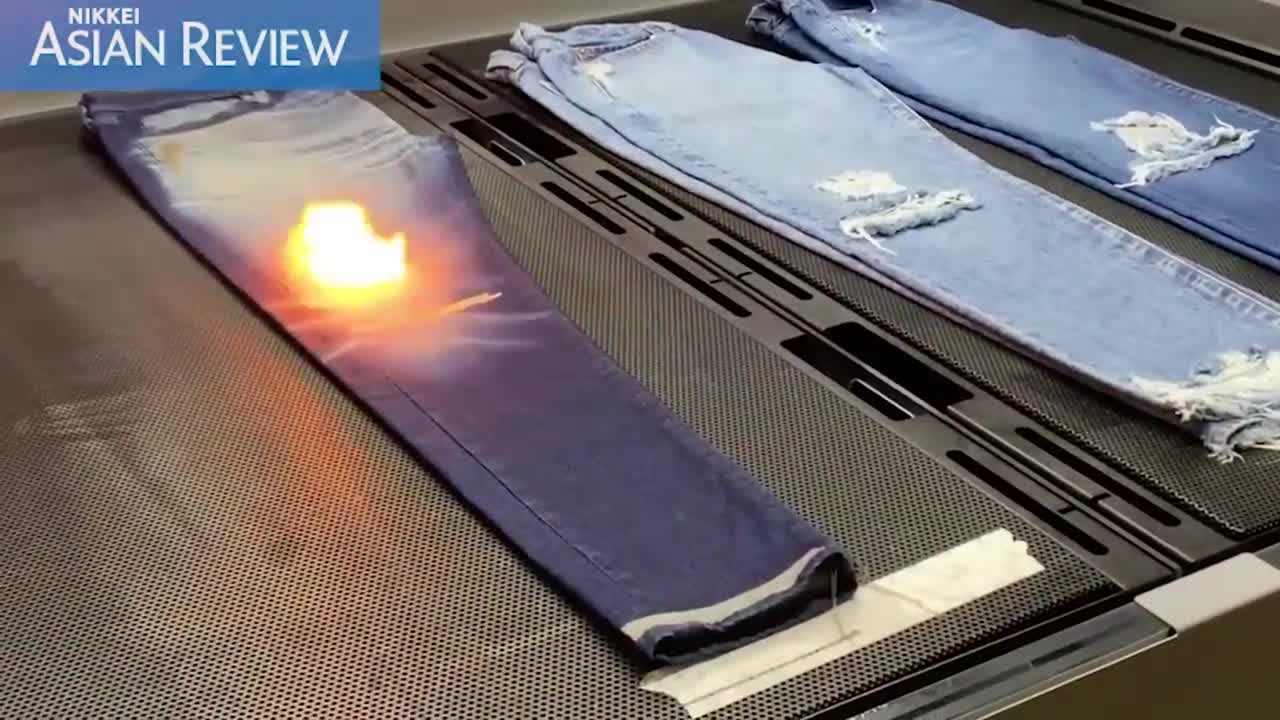 Uniqlo uses lasers to make distressed denim jeans to cut water consumption