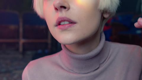 A Woman with Rainbow Light on Her Face