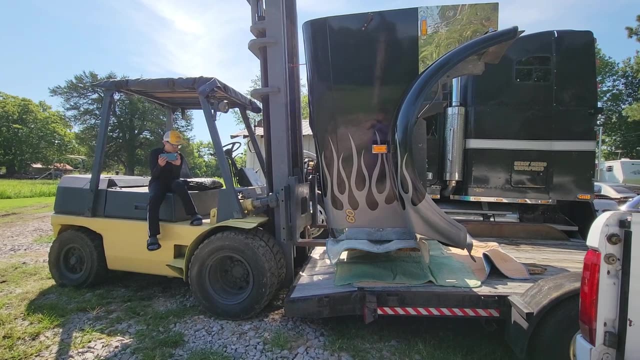 REMOVING THE HOOD FROM THE FREIGHTLINER