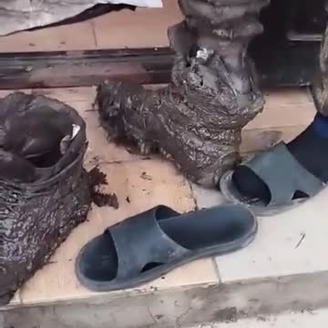 Ukrainian soldier taking off his boots after 5 days in trenches