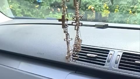 Slo-mo necklace w/ crucifixes swinging