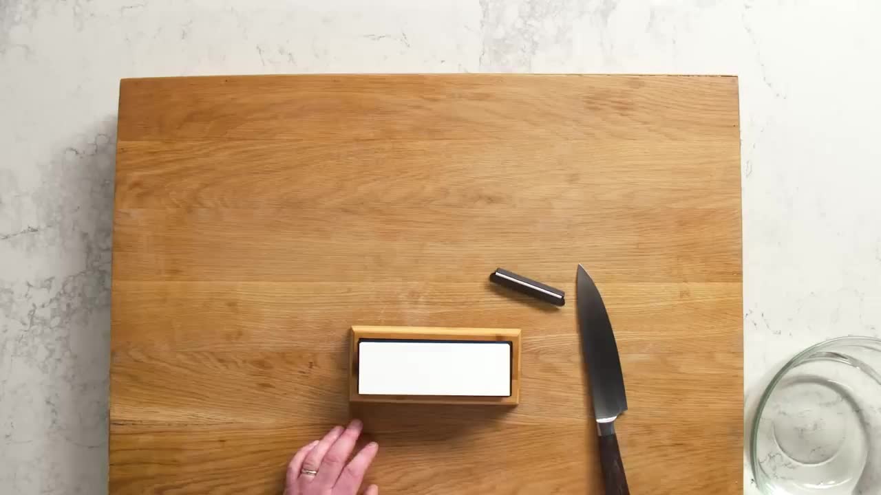 Use a manual knife grinder