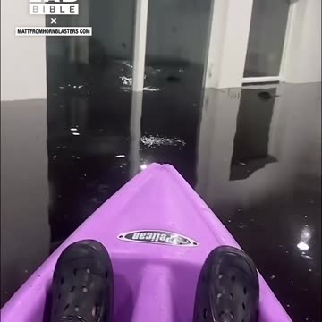 Man kayaking in his living room after hurricane 😲