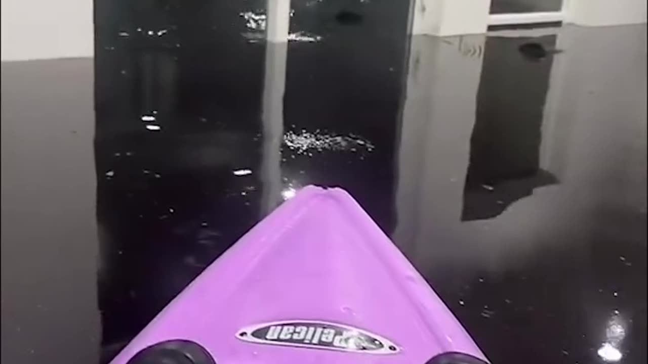 Man kayaking in his living room after hurricane 😲