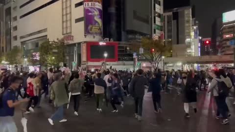 Japanese fans celebrate their stunning 2-1 win over Germany at the 2022 World Cup in Qatar