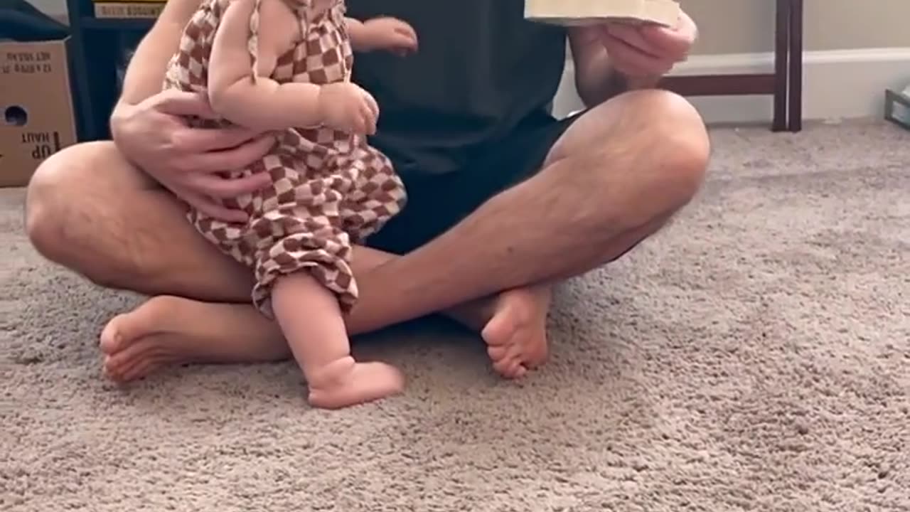 Cute baby who loves books