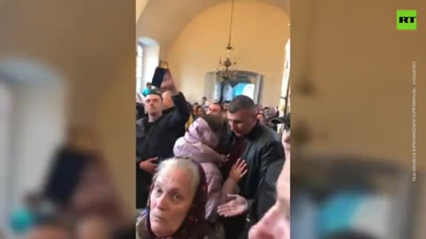 Ukranian police arrested a priest during service. *1min**