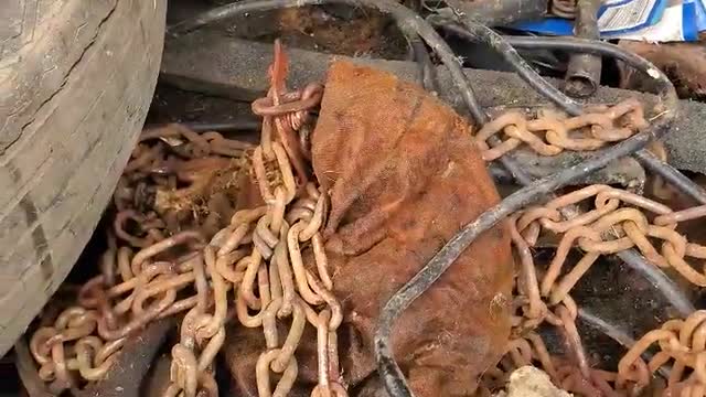 A very old car found in an abandoned warehouse