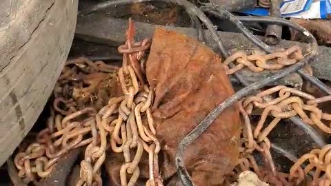 A very old car found in an abandoned warehouse