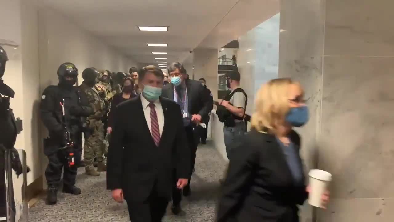 US senators returning to the Senate chambers.