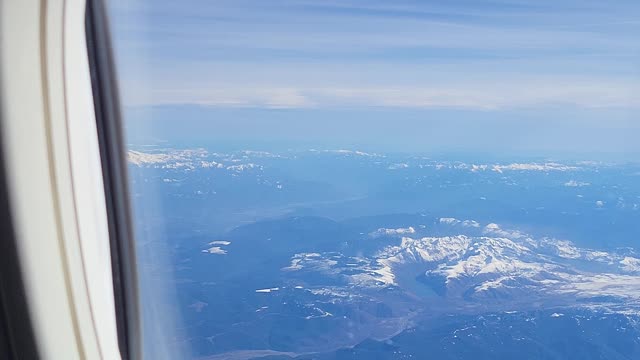 From the airplane window mounts st Helens Adams and rainier