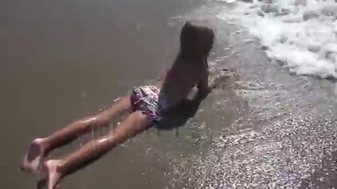 child playing in sea sand beach little girl on tropical exotic sea coastline