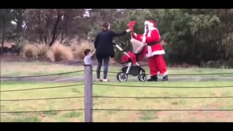 Santa Claus is playing tricks on passers-by, haha.