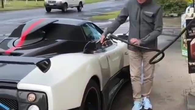 The handsome old man and his lovely car