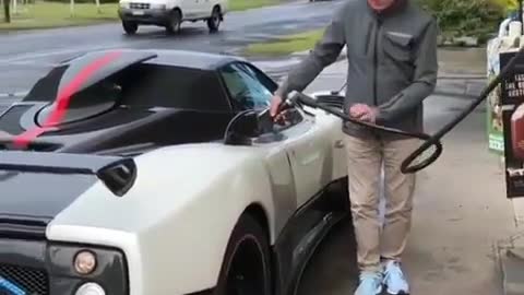 The handsome old man and his lovely car