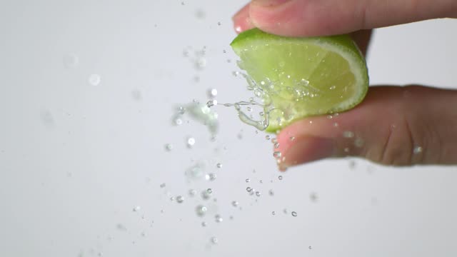 Squeezing a lemon in slow motion