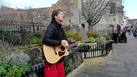 Ben Westwood Busking a song in Glastonbury