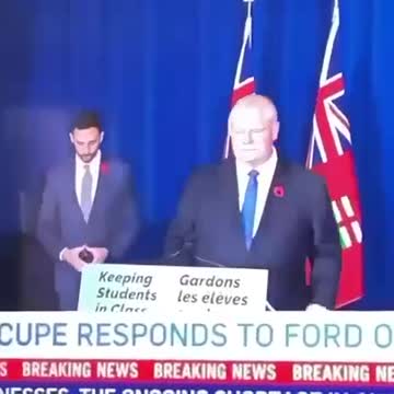 hand sign and red flower of the death cult