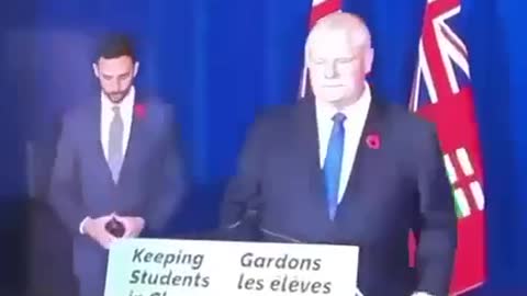 hand sign and red flower of the death cult