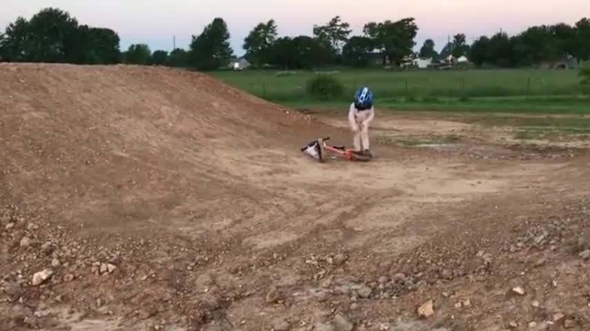 Girl Rides Bike Down Dirt Hill and Faceplants