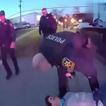 Handcuffed suspect violanty assaulted by cops while other cops watch.