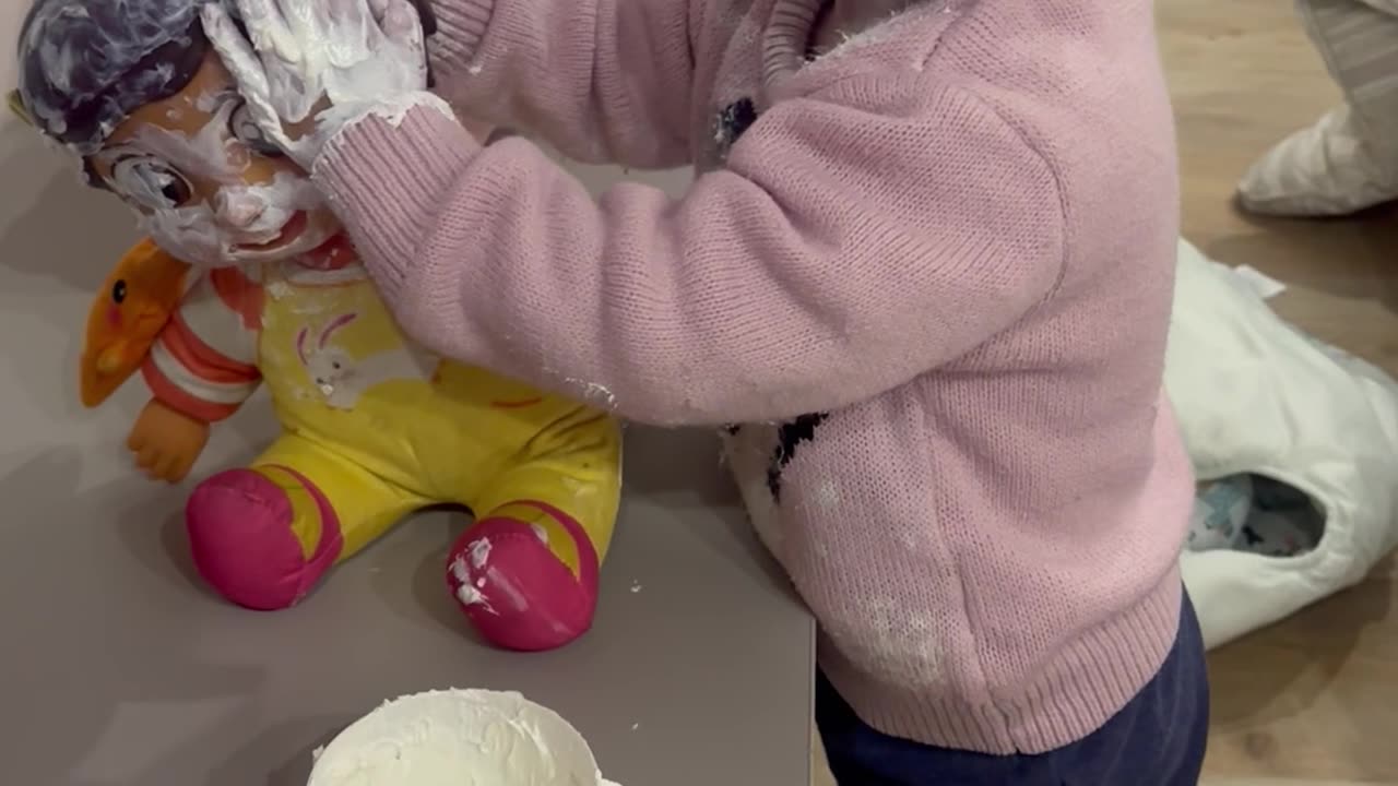 Toddler and Her Doll Get Covered in Cream