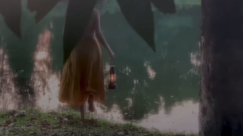 The young girl strolled along the river bank.