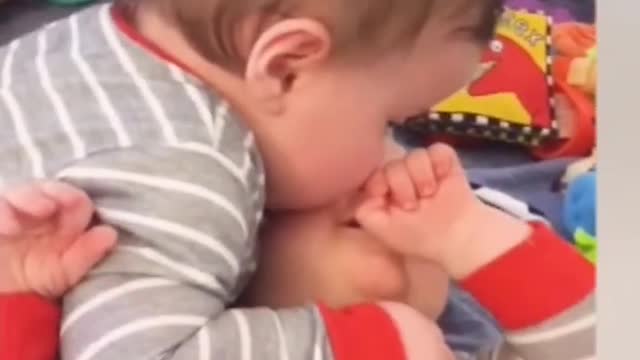 cute baby twins playing together