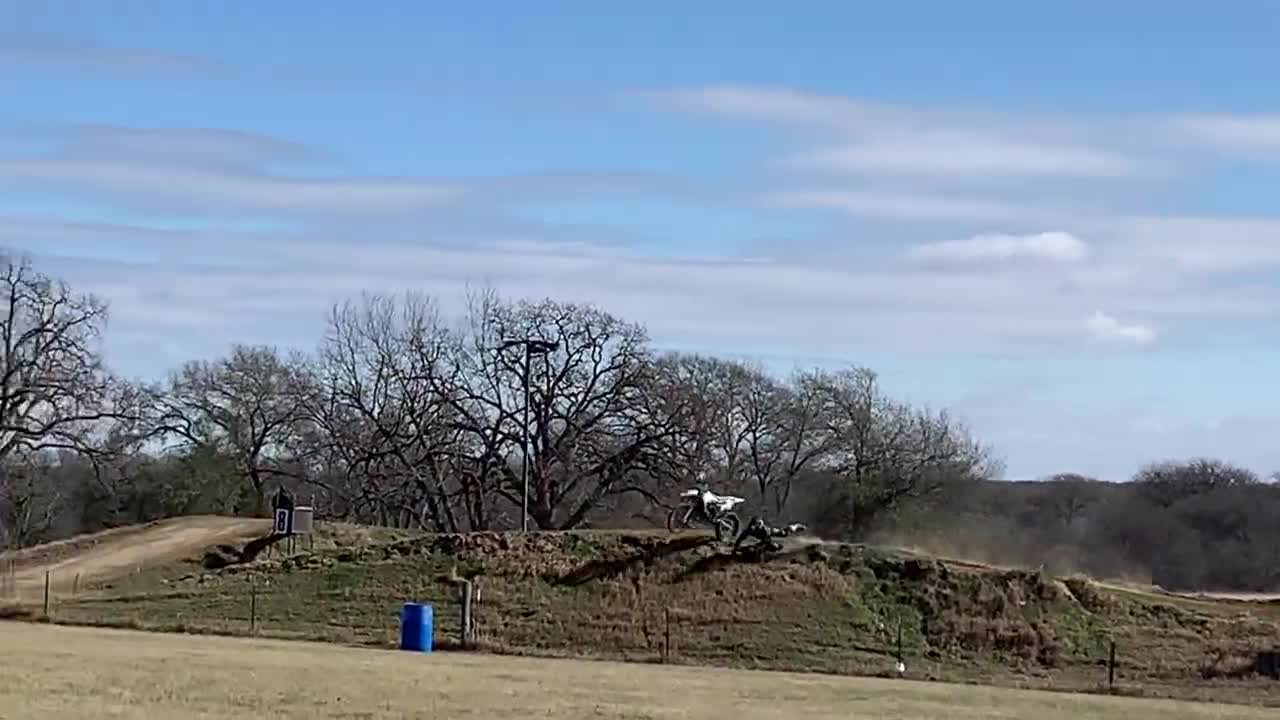 Guy Attempts a Jump in a Motocross Round but Misses His Landing and Falls