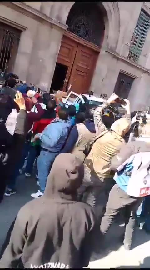 Angry Crowd breaks down the Door of the Mexico Presidential Palace