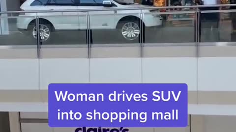 Woman drives SUV into shopping mall