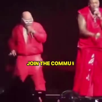 Busta Rhymes wearing a dress and paying his dues to the club.