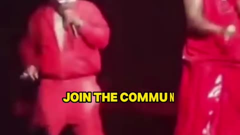 Busta Rhymes wearing a dress and paying his dues to the club.