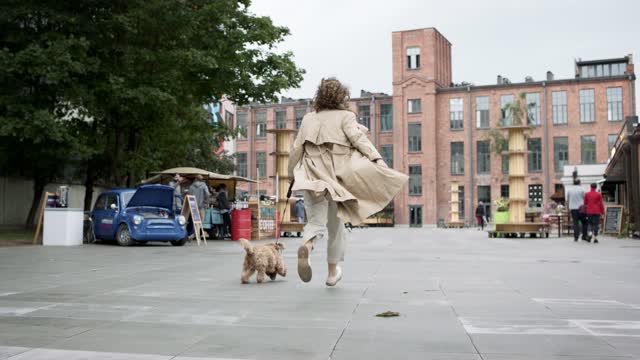 Woman Running With Her Dog