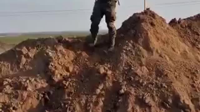 Installation of the flag of the Russian Federation on the outskirts of the village of Nikolaevka