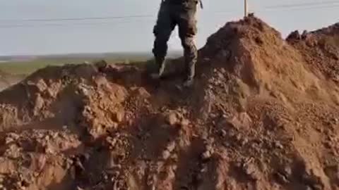 Installation of the flag of the Russian Federation on the outskirts of the village of Nikolaevka