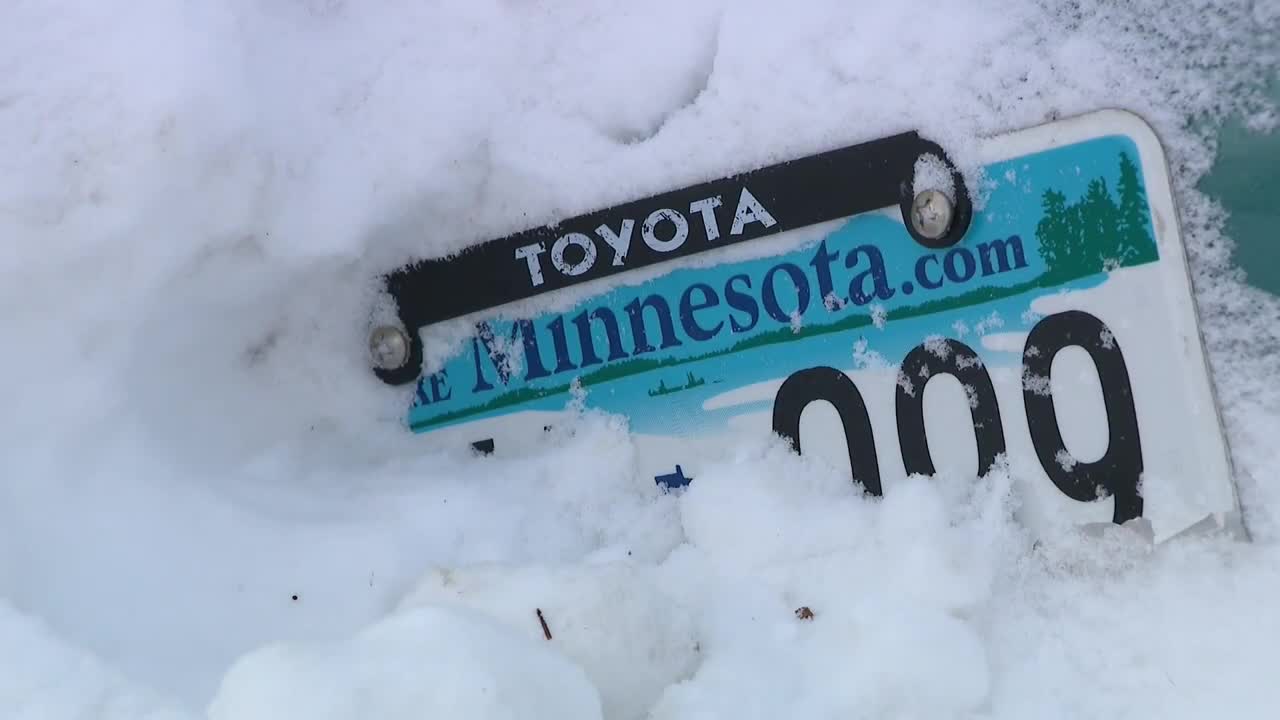 Car wedged in Minneapolis snowbank