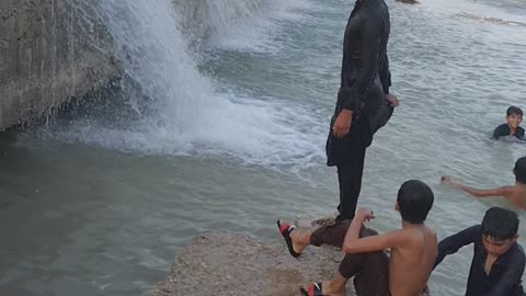 Students enjoying waterfall