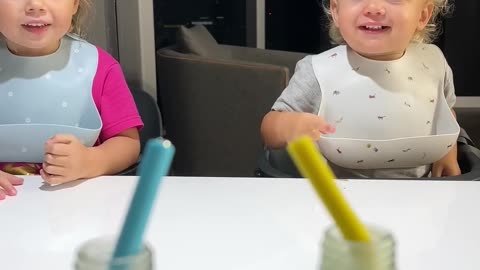 Funny baby girl and boy smile