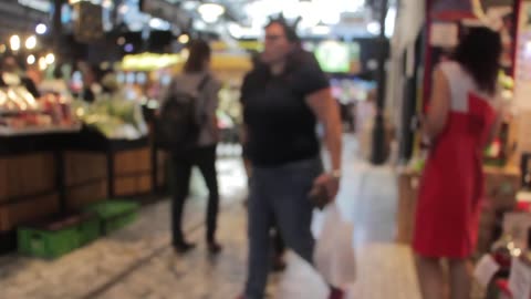 People Shopping in Indoor Market