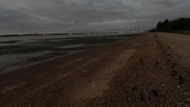 Evening hiking along a river . GoPro.