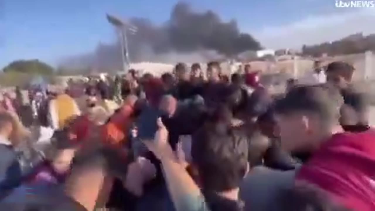 ITV interviews a man in a group waving a white flag at Israeli forces in Gaza get shot at.