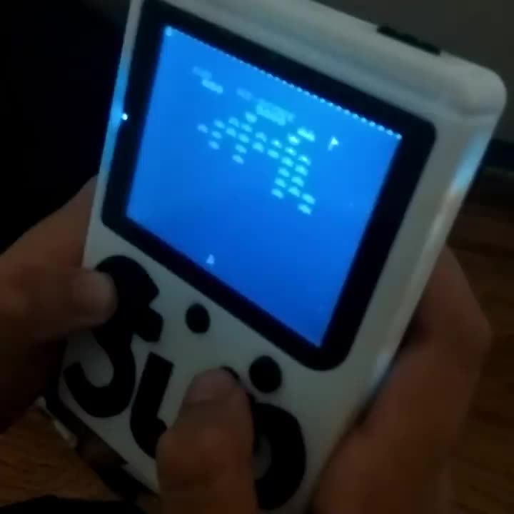 "Game boy" style retro-console with Galaxian game...