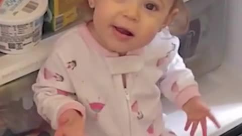 Funny Baby sitting in Frigo