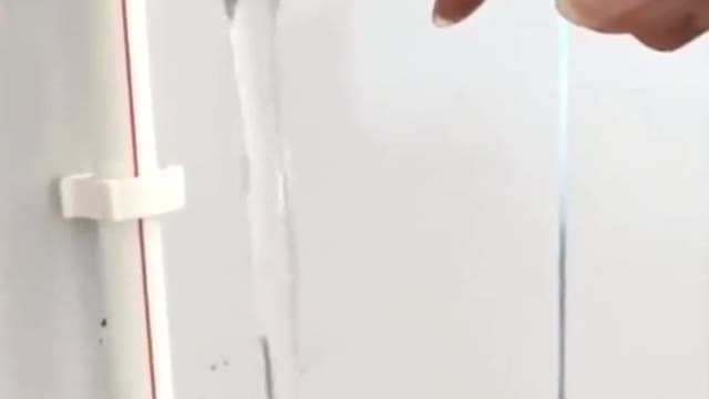 your teammate kicks open the door to the small building on the left.