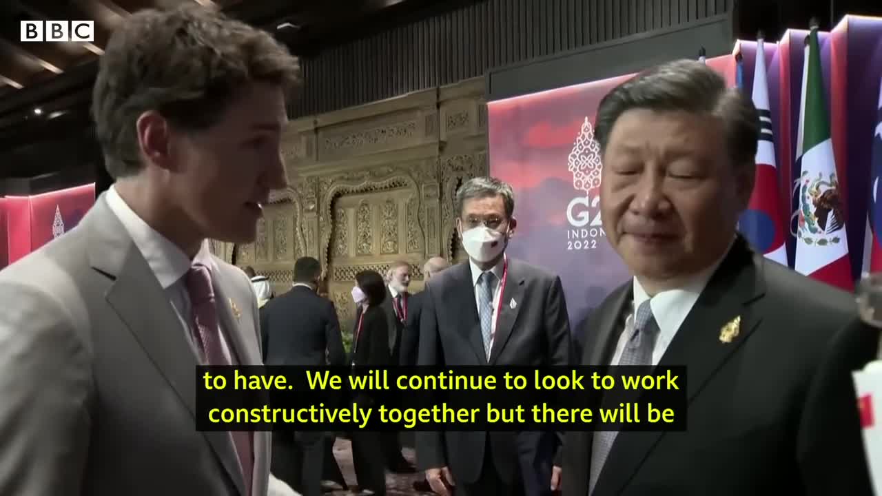 China and Canada leaders caught having tense exchange on camera - BBC News