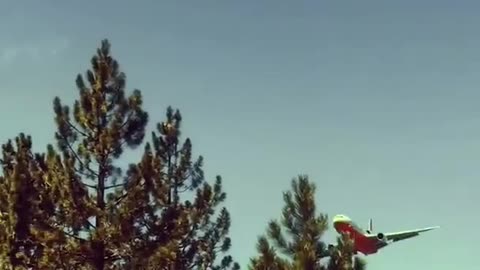 Fire Fighters Fly Over American Flag