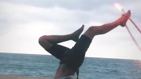Guy Shows Cool Moves While Spinning Hula Hoop With Fire At Beach